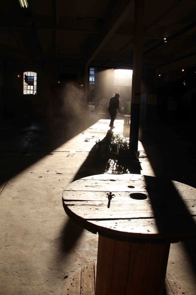 SOUTH AFRICA: A lady sweeps the dusty floor of The Market on Main at the Maboneng Precinct, after the market closed. The Market on Main Market opens every Sunday from 10:00 - 15:00, at 264 Fox Strees, Johannesburg, Gauteng, South Africa. © JABULILE PEARL HLANZE