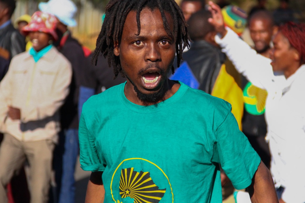 SOUTH AFRICA: A Pan Africanist Congress of Azania (PAC) member sings their party anthem at Constitutional Hill, Hillbrow, Johannesburg celebrating Soweto Day on Tuesday, 16 June 2015. The event was aimed to honour and commemorate Zeph Mothopeng who died in June 16, 1976. © JABULILE PEARL HLANZE