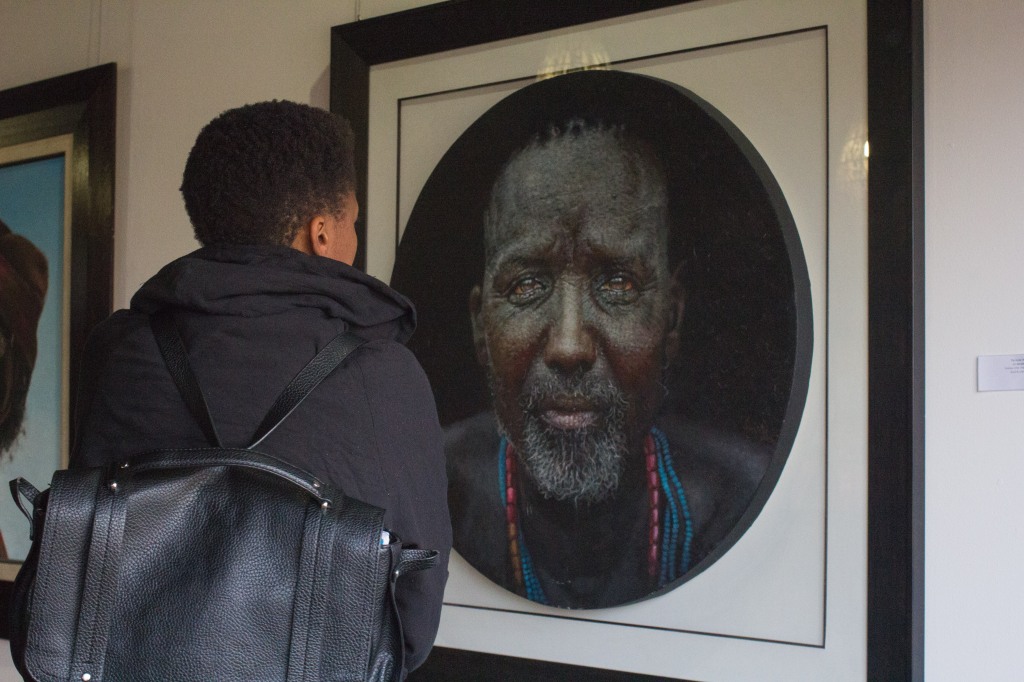 SOUTH AFRICA – SOWETO: A guests at Loyiso Mkize's solo exhibition called 