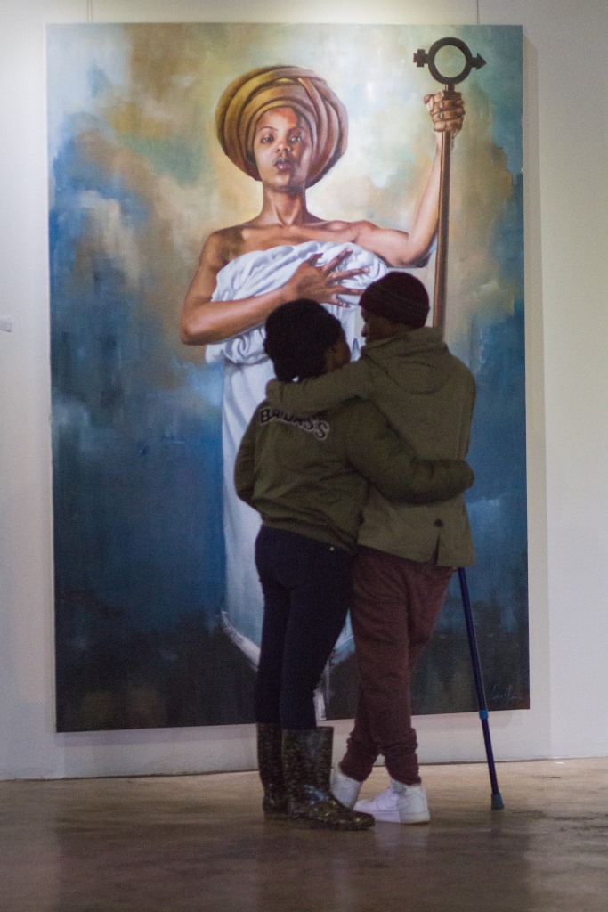 SOUTH AFRICA – SOWETO: A couple shares a moment at Loyiso Mkize's solo exhibition called 