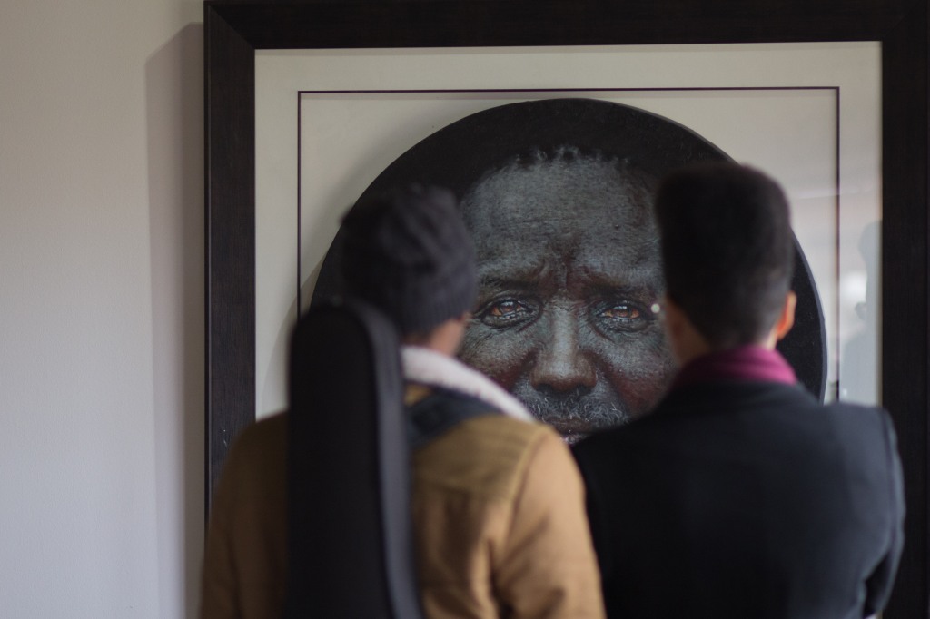 SOUTH AFRICA – SOWETO: A couple seen viewing one of the images titled ' The gentleman, which was part of the solo exhibitions called 